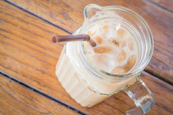 Close up fresh iced coffee latte in glass pitcher