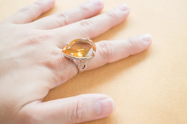 Hand on gem stone jewellery ring