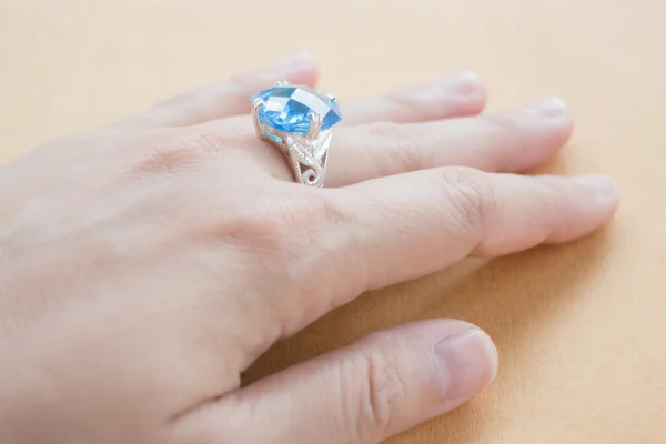 Hand on gem stone jewellery ring