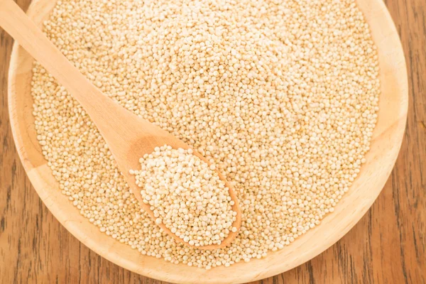 Quinoa grain in wooden plate