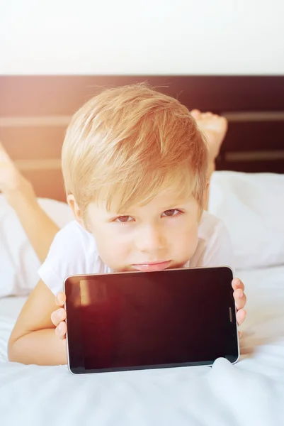Portrait of Kid Shows Smartphone Screen . Modern technologies