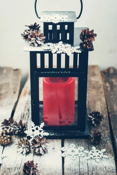 Christmas Lantern with Red Candle on Wooden Table