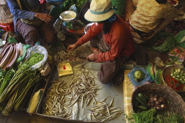 A busy scene of shoppers and market vendors in Siem Reap Market