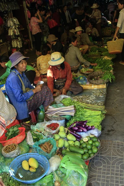 People sell vegetables at the local market, Siem Reap, Cambodia
