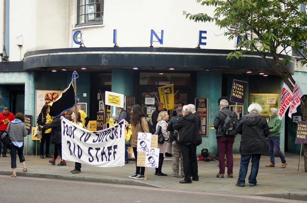 Workers strike over living wage and job cuts