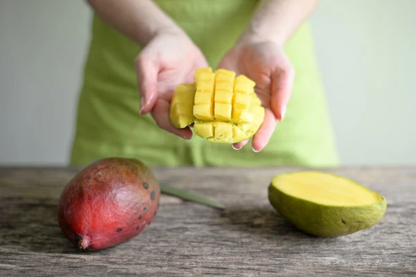 Hand Holding Fresh Mango , Cut in Square Shape Concept of Food A