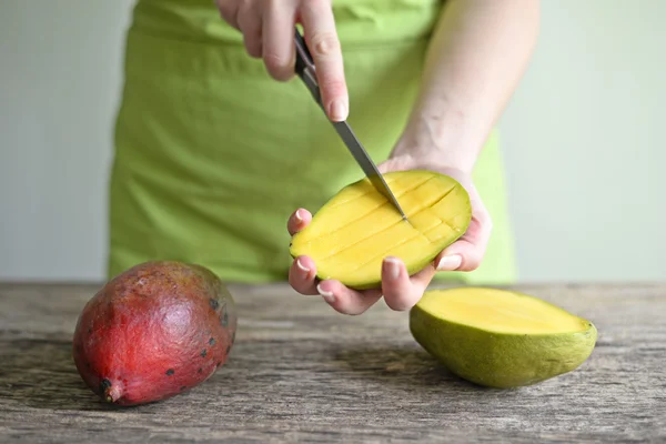 Hand Holding Fresh Mango , Cut in Square Shape Concept of Food A