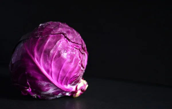 Red cabbage on blackboard