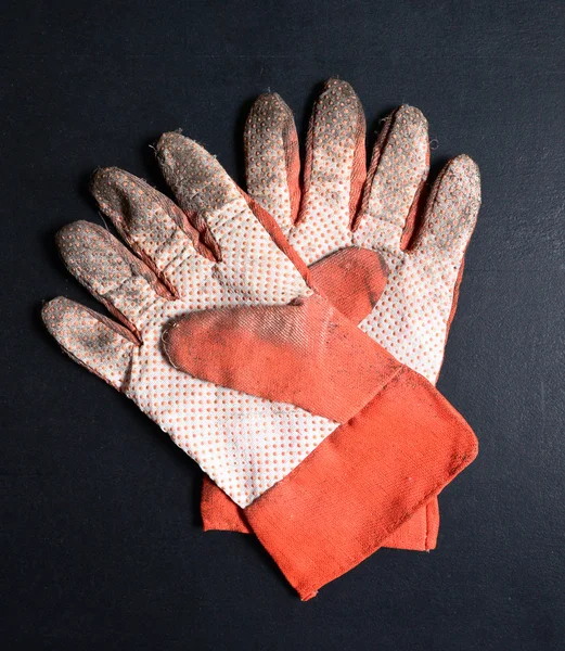 Garden gloves on blackboard