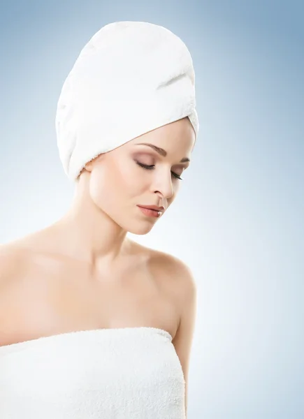 Natural woman wrapped in a towel