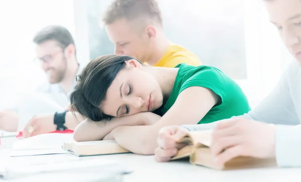 Tired girl sleeping on lesson.