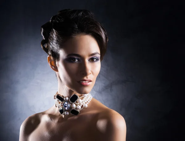 Woman in jewels of platinum and stones