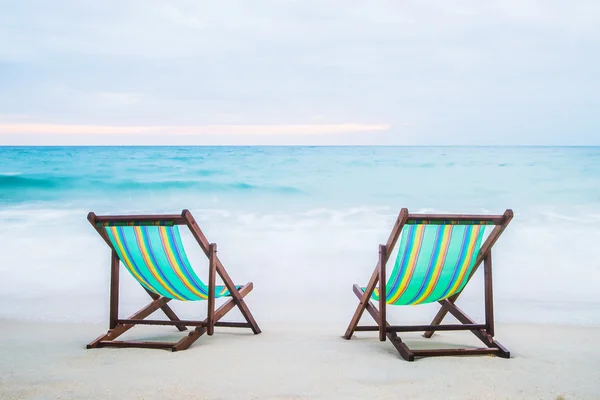 Lounge chairs on tropical beach