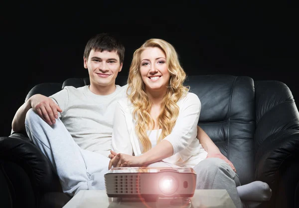 Couple watching movie on projector