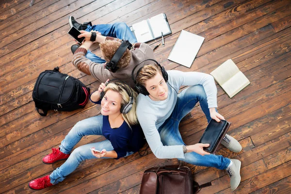 Students using smartphones and tablet