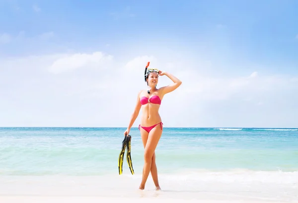Woman in bikini posing with a diving mask