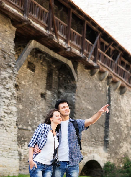 Couple exploring the medieval buildings
