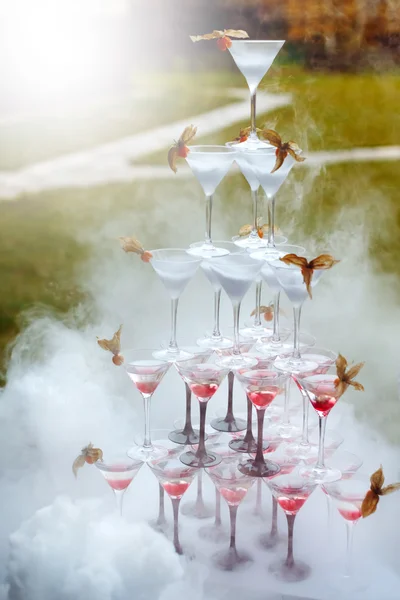 Pyramid of Champagne Glasses with Dry Ice Vapor