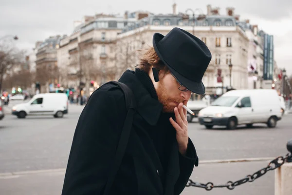 Thoughtful Bearded Man Wearing Hat Smoking