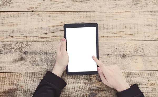 Digital tablet computer with isolated screen in male hands. Top view with copy space. Free space for text. Hipster style