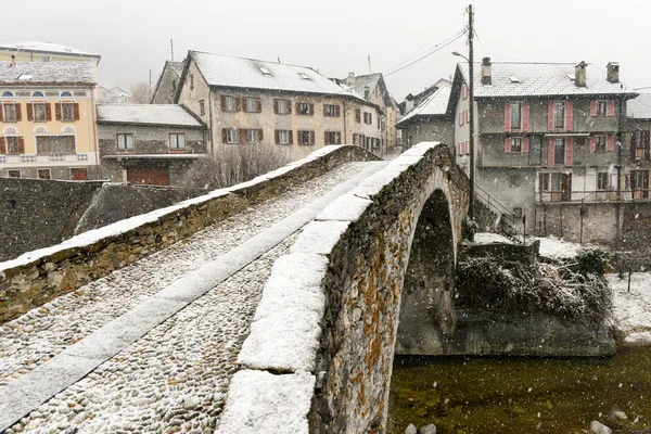 Roman bridge at Giornico onder snow on Leventina valley