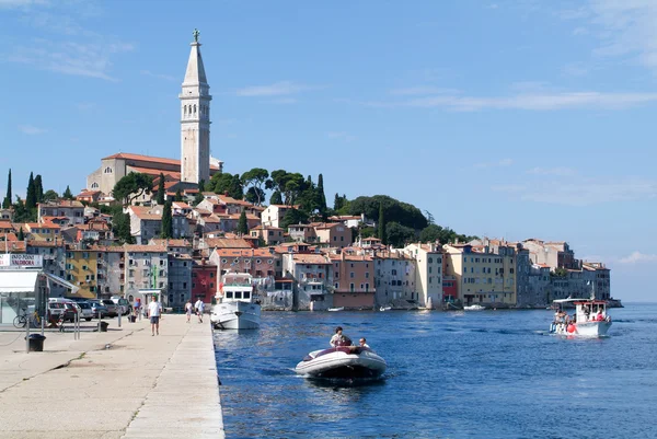 People on boats in front of Rovinj on Croatia