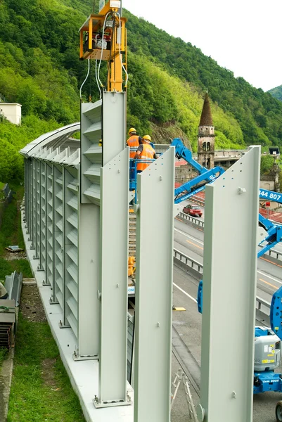 Workers during the installation of noise barriers