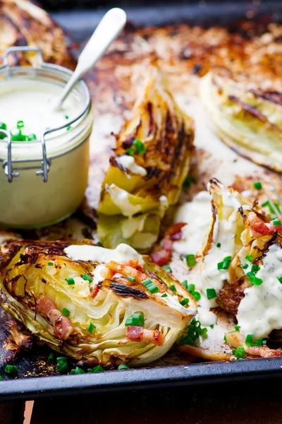 Grilled cabbage  with  cheese sauce.