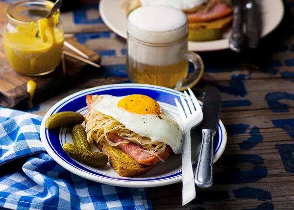 Sandwich with sauerkraut , ham and fried eggs