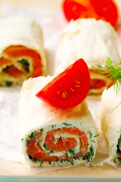 Flat  bread roll with cream cheese and salmon