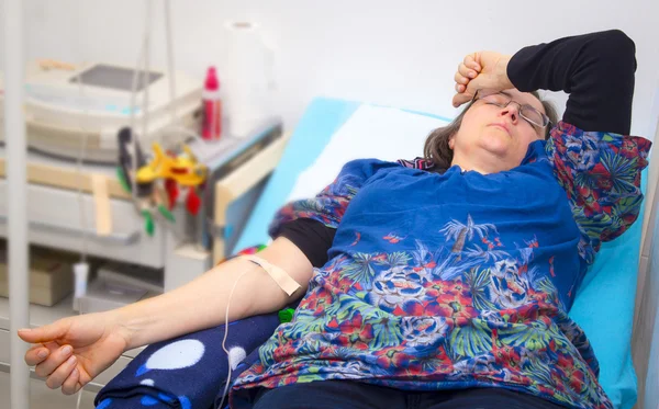 Intravenous infusion therapy on mature woman