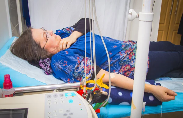 Intravenous infusion therapy on mature woman