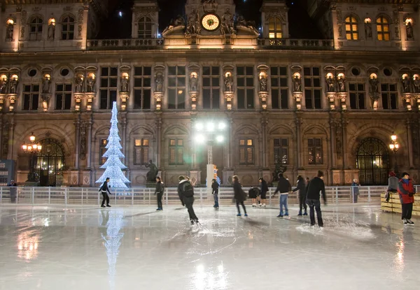 PARIS-JANUARY 9: New Year\'s ice skating in front of the Hotel de ville at night on January 9,2012 in Paris.