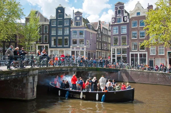 AMSTERDAM-APRIL 27:  King\'s Day boating through  Amsterdam canals on April 27, 2015, the Netherlands.