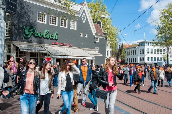 AMSTERDAM-APRIL 27: Young people celebrate the King's Day on Amsterdam street on April 27,2015, the Netherlands.