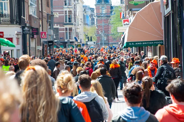 AMSTERDAM-APRIL 27:Thousands people on Amsterdam street during King\'s Day on April 27,2015, the Netherlands.