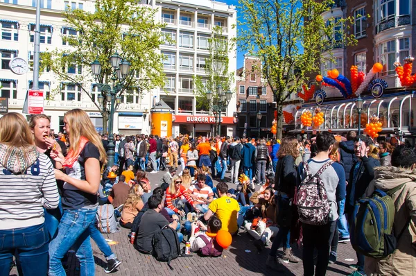 AMSTERDAM-APRIL 27: Crowd of people on Amsterdam street during King\'s Day on April 27,2015 in Amsterdam, the Netherlands.