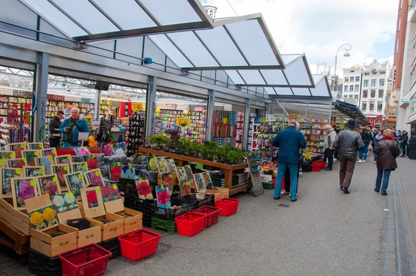 Small shops offer plenty houseplants and bulbs on the Amsterdam Flower Market.