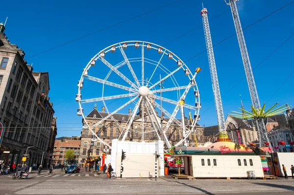 Ferris wheel on Dam Square on the eve of King\'s Day in Amsterdam.