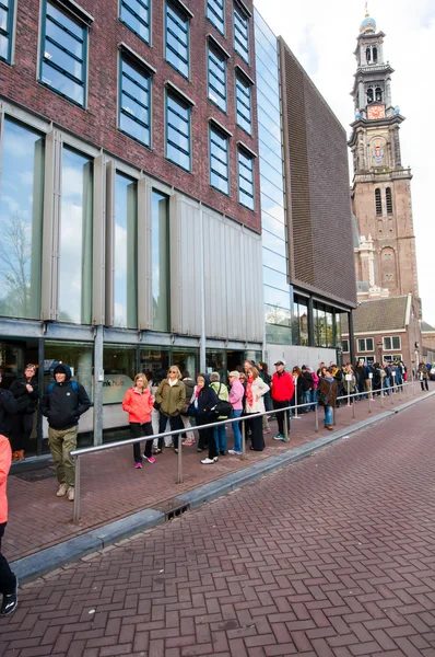 People  stand in line to visit the Anne Frank House Museum, Amsterdam.