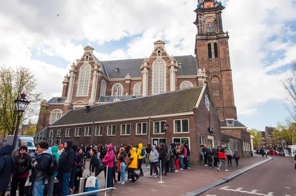 People and tourists stand in a queue to Anne Frank House Museum, the Netherlands.