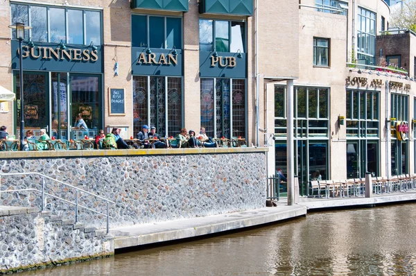 AMSTERDAM-APRIL 30: Undefined tourists have breakfast in Aran Irish Pub on April 30,2015, the Netherlands.