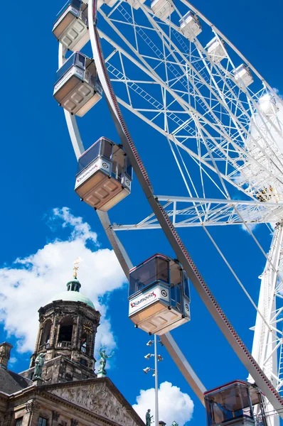 AMSTERDAM,NETHERLANDS-APRIL 30: Ferris wheel on Dam Square on April 30,2015 in Amsterdam.