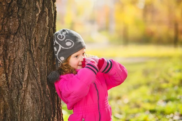 Surprised girl near a large tree. Ecological concept. Instagram
