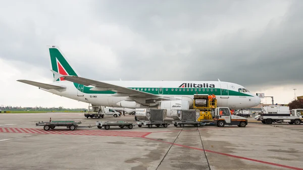 Boarding Alitalia Jet airplane  in Bologna airport.