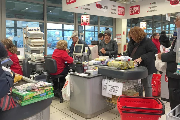 Queue of people inside Coop Supermarket