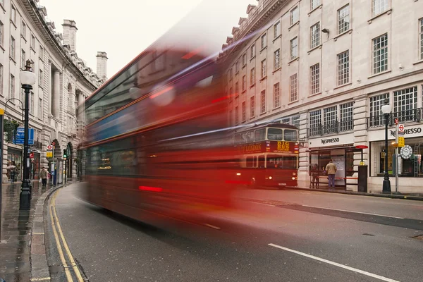 Traffic in Regent Street with red bus blurred