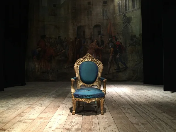 Isolated old armchair on the stage