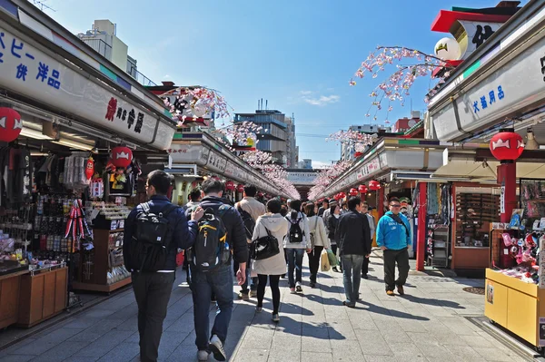 Tourists walk on Nakamise Dori in Sensoji shrine