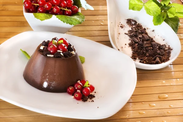 Chocolate pudding with red berries